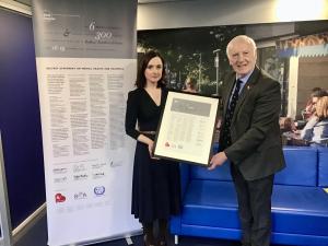 MHC Prof Siobhan O'Neill accepting the Belfast Statement on Mental Health and Deafness from Brian Symington MBE