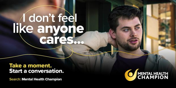 Take a Moment Campaign image says 'I don't feel like anyone cares...' and shows a man speaking with a friend